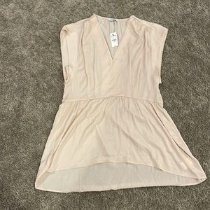 Express hi lo ivory top/almost a light pink. nwt